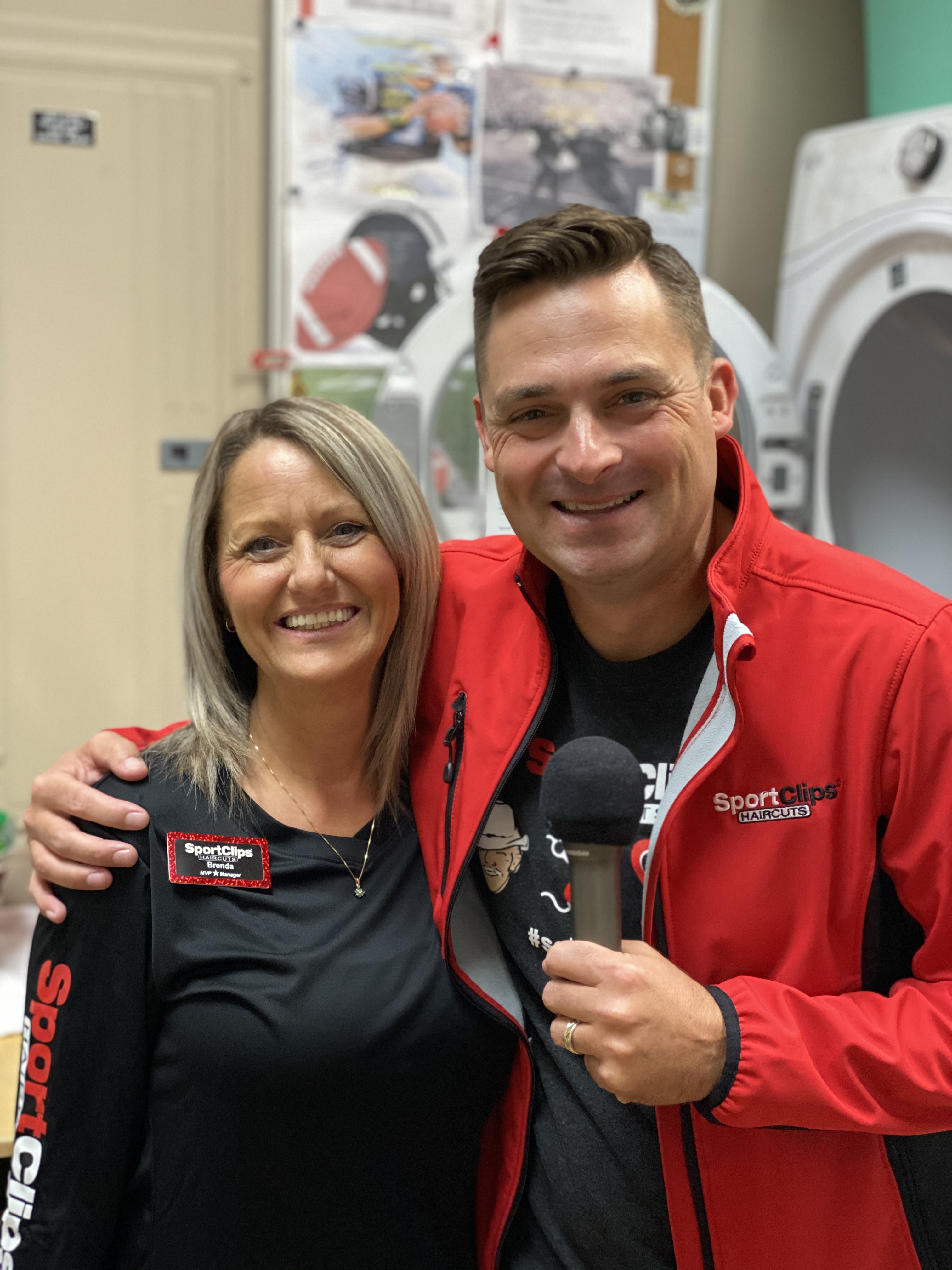 Chad Jordan and Brenda Long holding a microphone